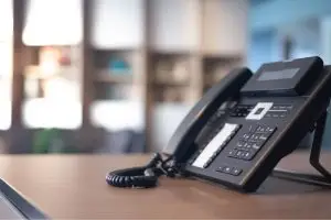 a voip phone in a desk